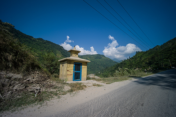 Small structure beside mountain road