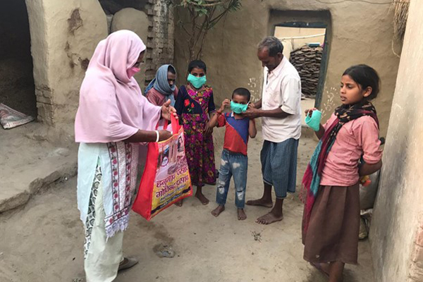 An Indian family wearing masks