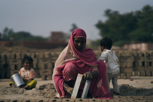 Woman working in brick factory